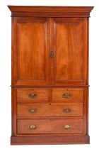A Victorian mahogany linen press, late 19th century; with moulded cornice above twin panel doors,