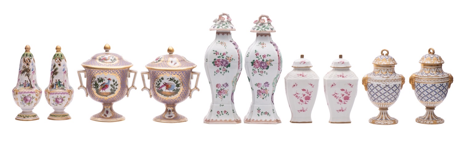 A mixed lot of Continental ceramics comprising a pair of Sevres-style vases and covers with blue