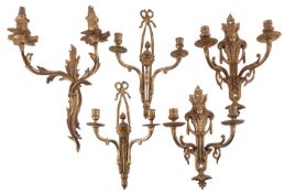 A pair of gilt metal twin light wall appliques in Louis XV / XVI Transitional style, 20th century,