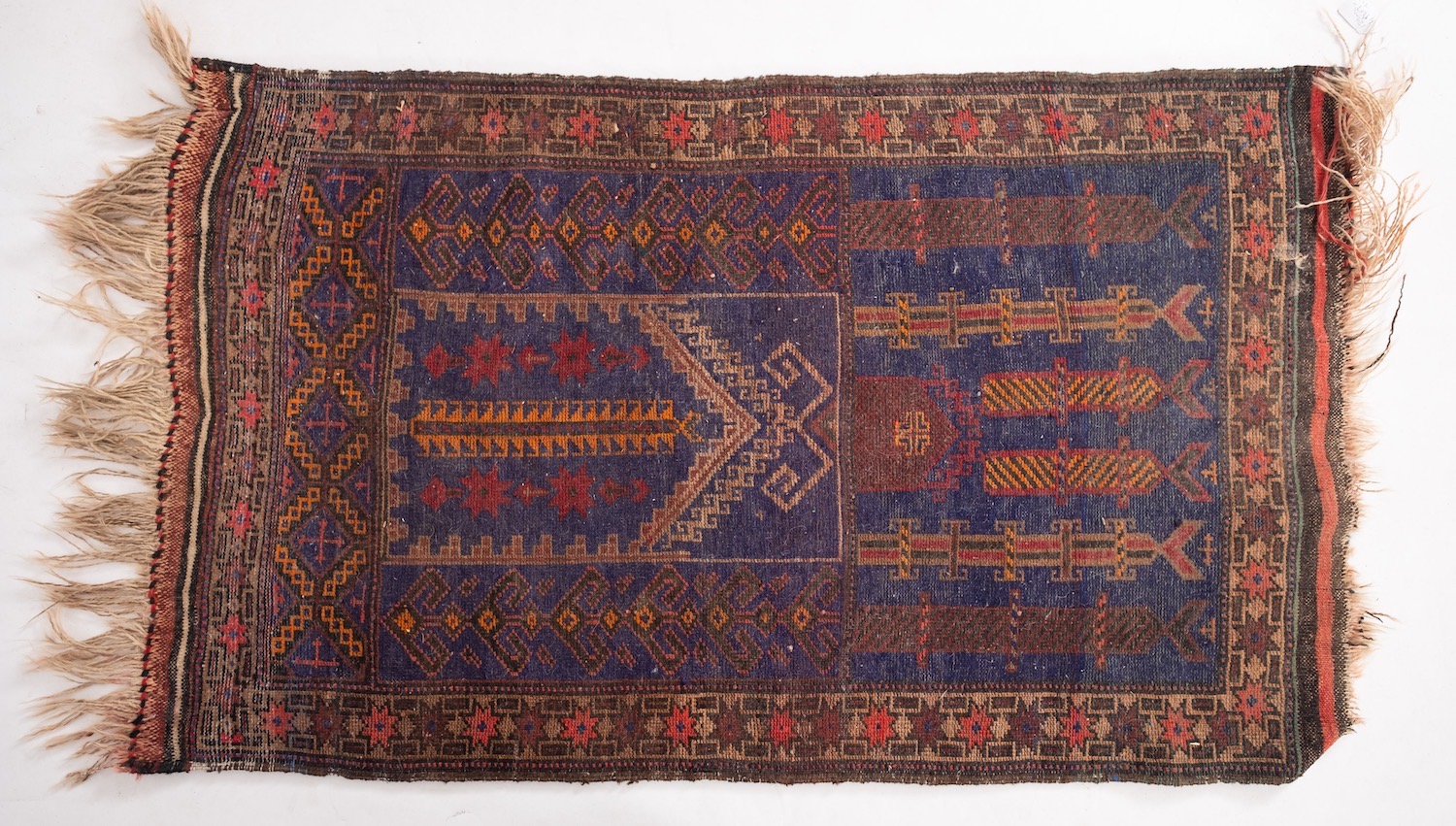 A Belouchistan rug, the indigo geometric field enclosed by a main wine lattice geometric border, - Image 4 of 4