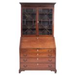 A George III mahogany bureau bookcase,