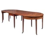 A George III mahogany extending dining table, circa 1800,