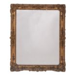 A Victorian carved giltwood and composition framed wall mirror in Rococo revival style,