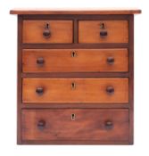 A miniature walnut chest of drawers,