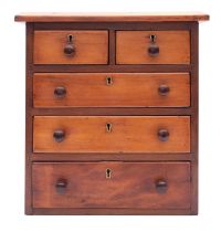 A miniature walnut chest of drawers,