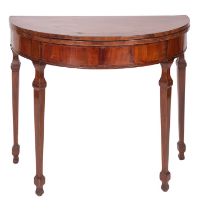 A late George III mahogany and crossbanded demi-lune card table,