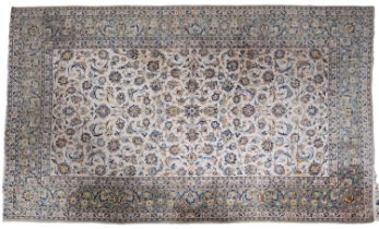 A Kashan carpet, the ivory field with an all over Shah Abbas design,