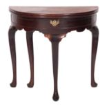 A George II mahogany and walnut demi-lune tea table,