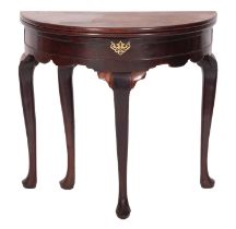 A George II mahogany and walnut demi-lune tea table,
