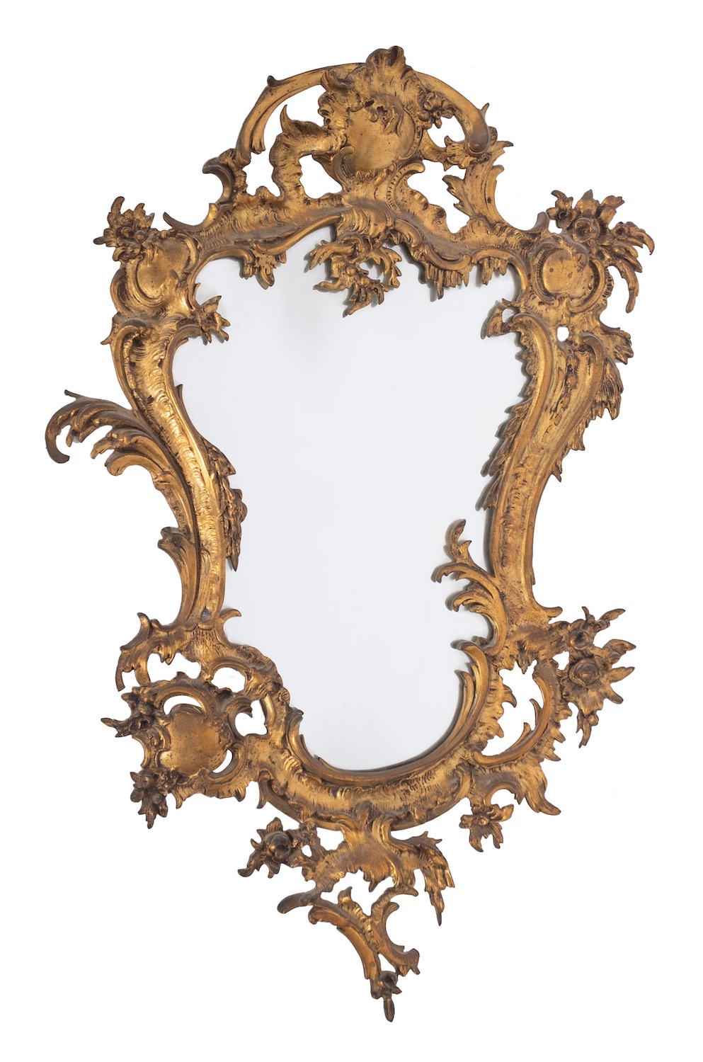 A gilt metal framed wall mirror in Rococo style, second half 19th century; of cartouche form,