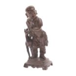 A Chinese bronze figure of a boy holding a parrot, a gourd on his back and a faun at his side,