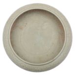 A Chinese celadon bowl of compressed form,