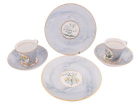 A pair of Chamberlains Worcester botanical cups and saucers and two matching plates each painted