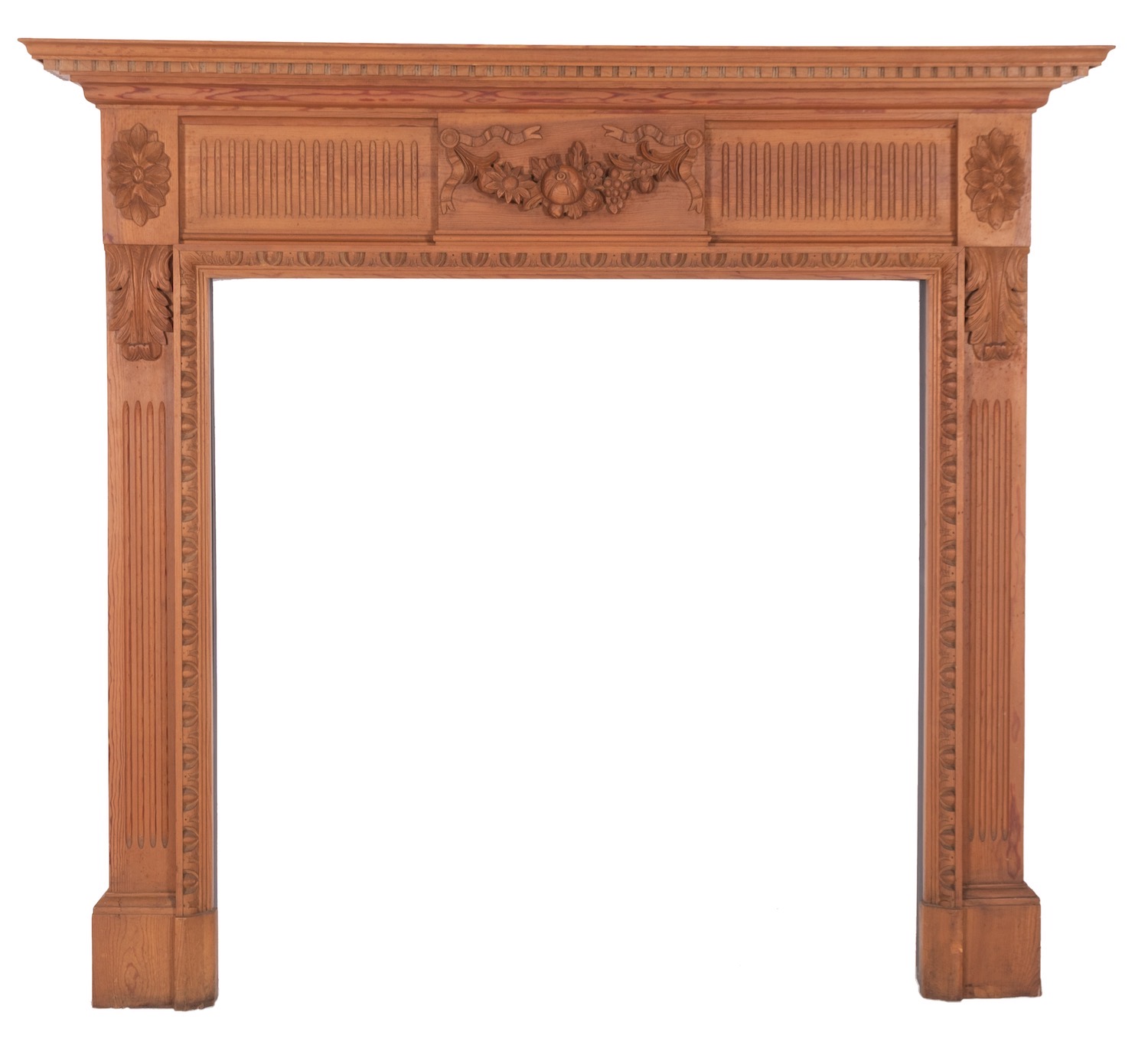 A carved pine fire surround in George III style,