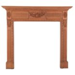 A carved pine fire surround in George III style,