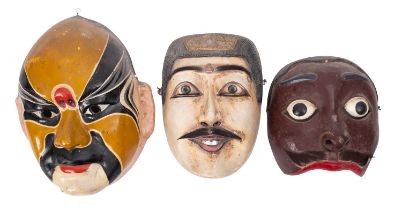 Three Oriental masks, comprising two Indonesian carved wooden Topeng dance masks of King Dalem,