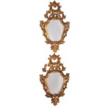 A pair of carved and giltwood framed wall mirrors in Continental 18th century style,