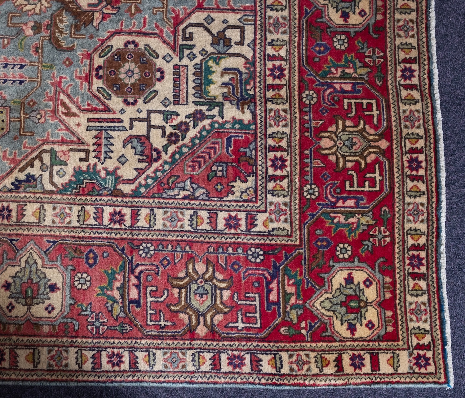 A Heriz carpet, the pastel blue field with a central rose geometric pole medallion, - Image 2 of 3