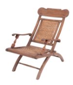 A teak and rattan folding planter's chair, East Indies,