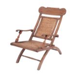 A teak and rattan folding planter's chair, East Indies,