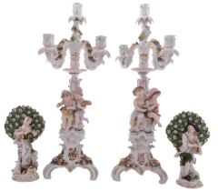 A pair of Sitzendorf porcelain five-light figural candelabra and a pair of Frankenthal-style bocage