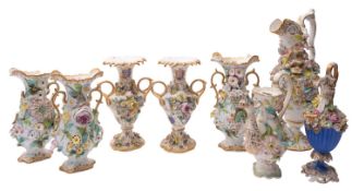 A group of Coalbrookdale-style flower encrusted porcelain vases and ewers circa 1830-50 all with