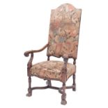 A carved walnut and upholstered elbow chair in Charles II style,