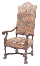 A carved walnut and upholstered elbow chair in Charles II style,