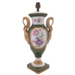 A Limoges porcelain lamp of urn shaped form with swan handles,