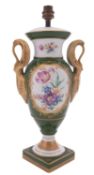 A Limoges porcelain lamp of urn shaped form with swan handles,