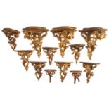 A group of twelve Italian carved and giltwood wall brackets,