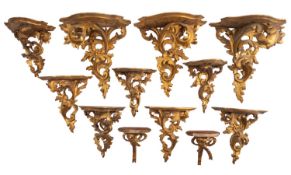 A group of twelve Italian carved and giltwood wall brackets,