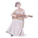 A Bing & Grondahl porcelain figure, Woman with Guitar, modelled after the original by Irminger,