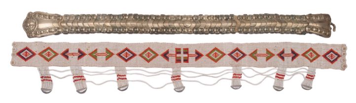 A South African beadwork belt and a Turkish/Ottoman articulated metal belt the first with geometric