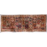 An Anatolian Kilim, the panelled field with a design of serrated lozenges in various colours,