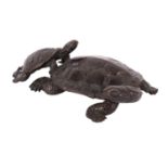 A small Japanese bronze okimono of two terrapins naturalistically modelled with the smaller