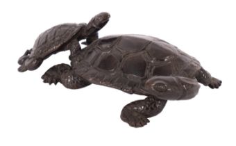 A small Japanese bronze okimono of two terrapins naturalistically modelled with the smaller