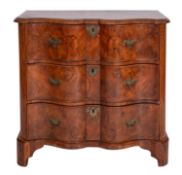 A Continental burr walnut and feather banded serpentine front chest of drawers,