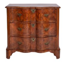A Continental burr walnut and feather banded serpentine front chest of drawers,