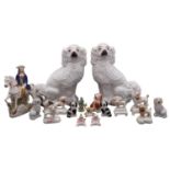 A collection of English and Continental pottery and porcelain figures of dogs, 19th/20th Century,