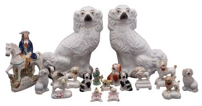 A collection of English and Continental pottery and porcelain figures of dogs, 19th/20th Century,