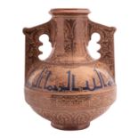 A Hispano Moresque vase of squat form with raised central band and two raised handles profusely