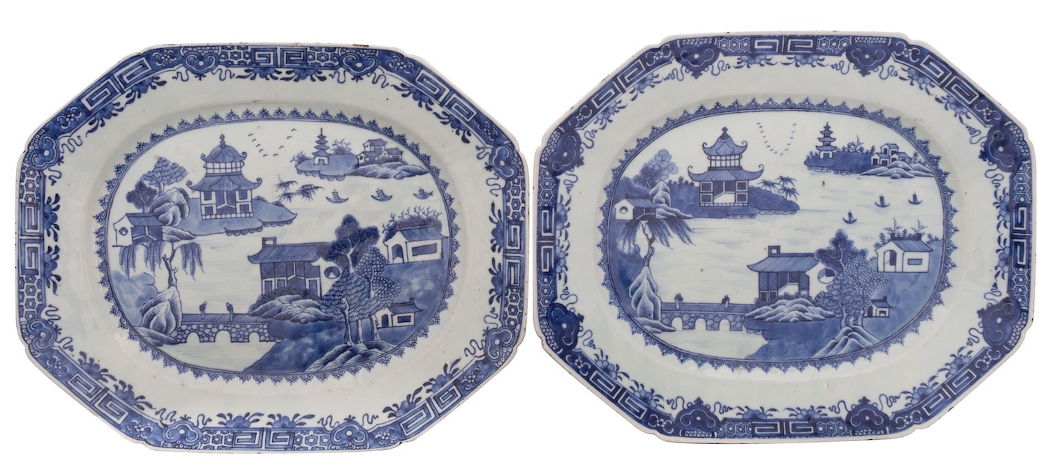 A pair of Chinese blue and white octagonal meat dishes painted with pagoda lake landscapes with two