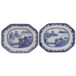 A pair of Chinese blue and white octagonal meat dishes painted with pagoda lake landscapes with two