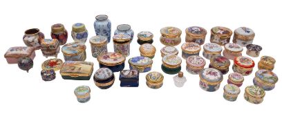 A large collection of Moorcroft, Halcyon Days, Crummles and other enamel boxes and miniature vases,