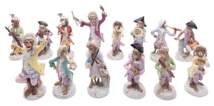 An assembled collection of twelve Continental porcelain monkey band musicians and two conductors
