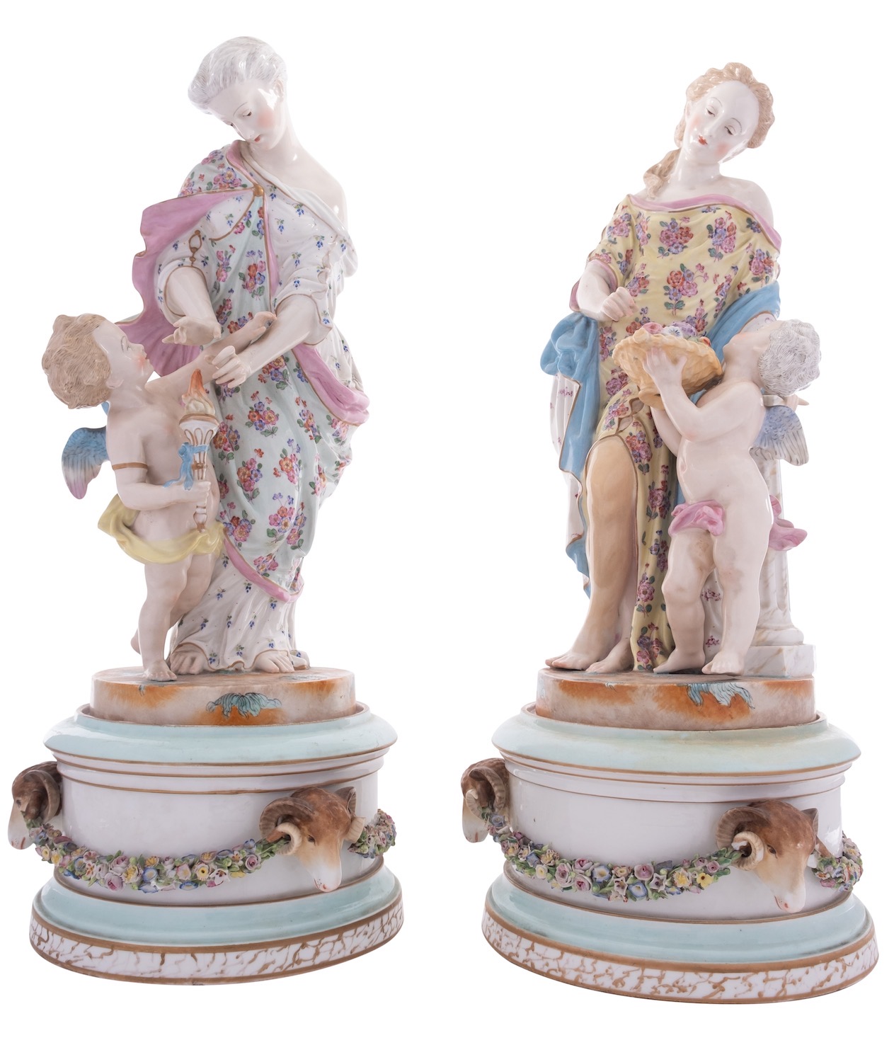 A pair of French porcelain figure groups and stands in the form of classical female figures
