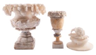 An Italian carved alabaster urn, circa 1900; in two sections,