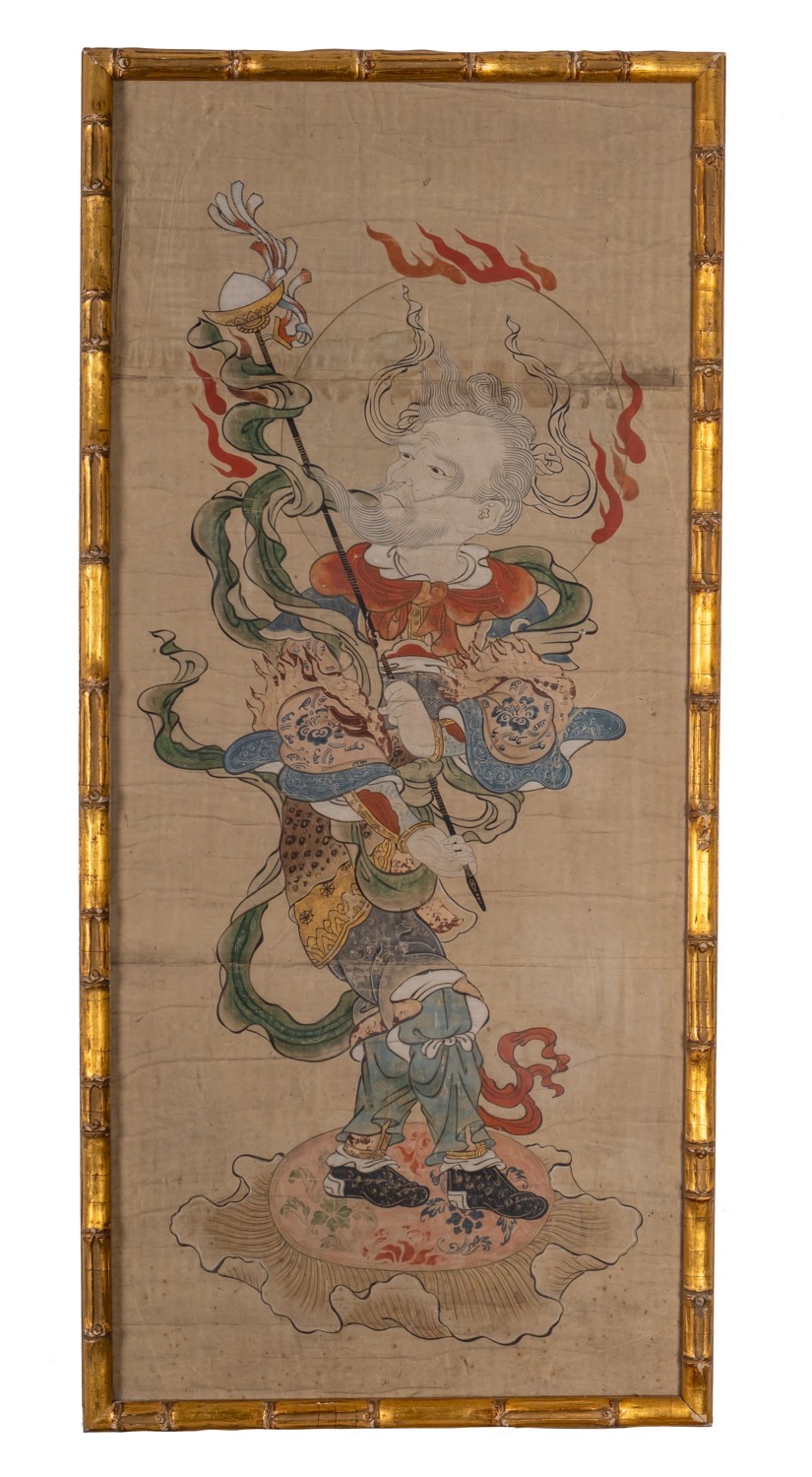 A Japanese gouache, of a flaming deity holding a staff, 73 x 32, in gilt faux bamboo frame.