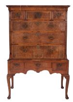 A George II walnut and feather banded chest on stand,